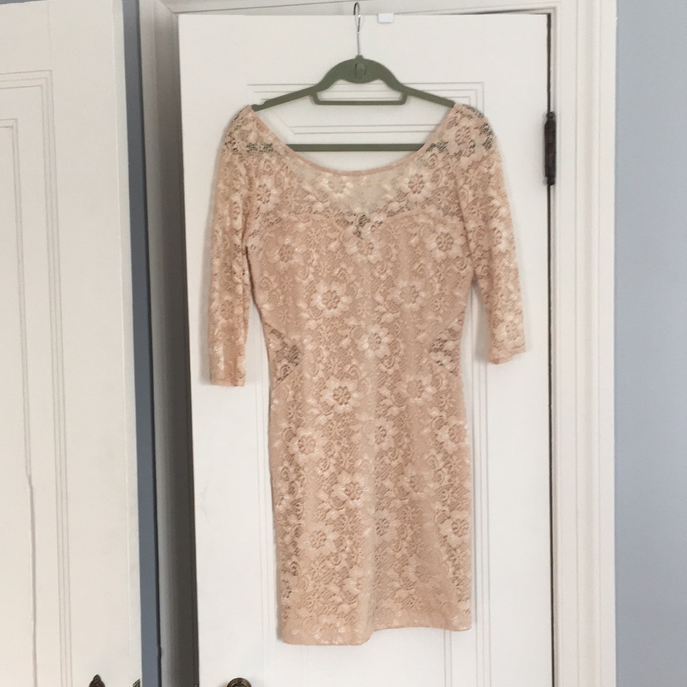 Beautiful nude/ blush mini dress with cut outs